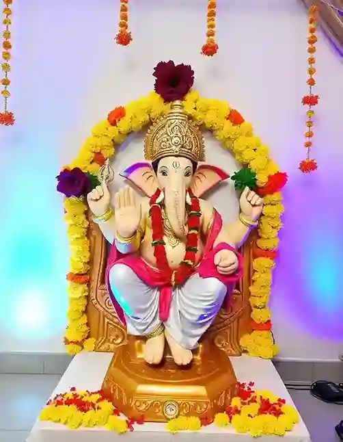 Ganesh Chaturthi home decoration with vibrant floral garlands and Ganesh idol | Vibrant Floral Ganesh Decoration | Ganesh Chaturthi Decoration | Decorations Guru